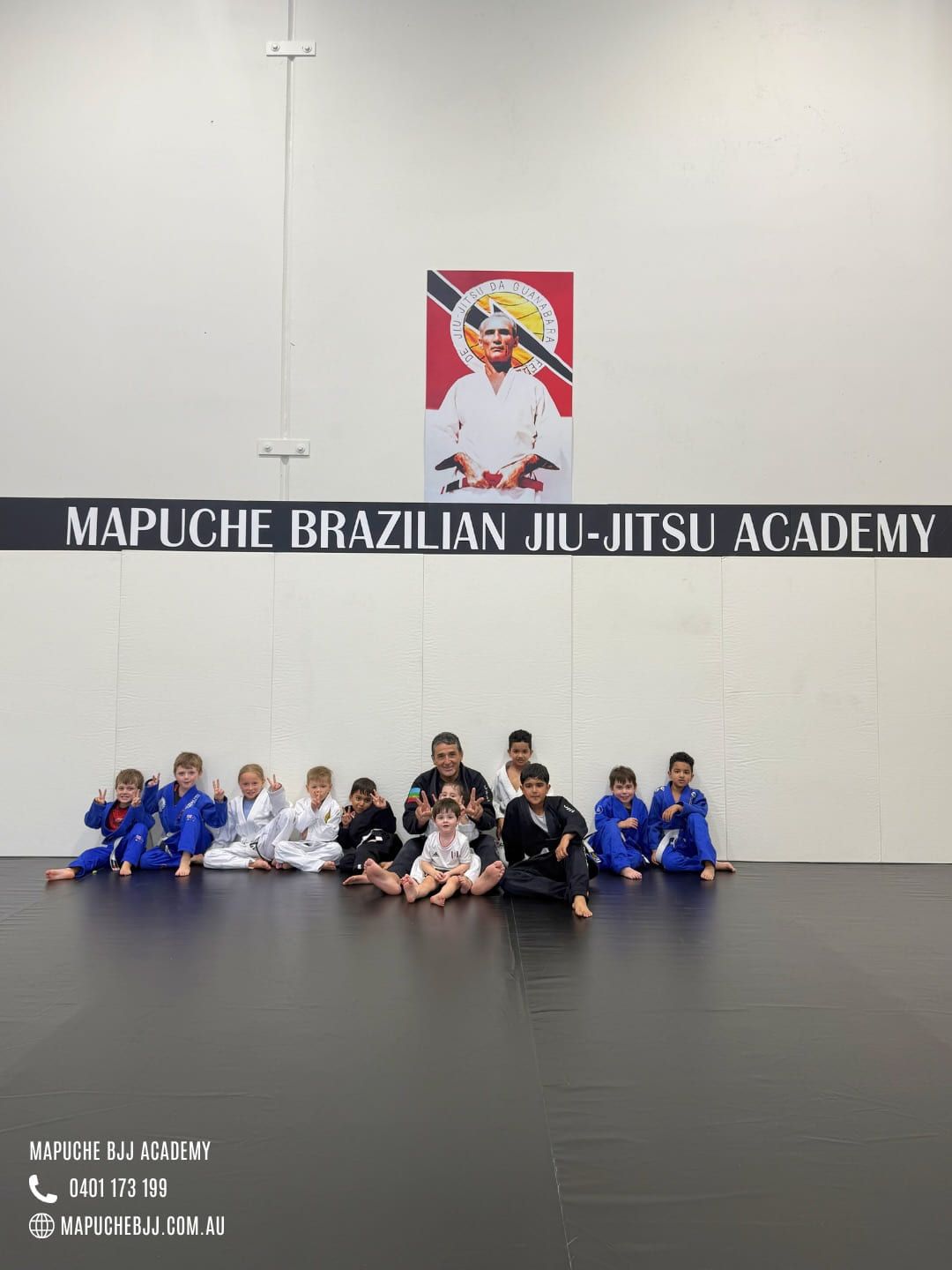 Little kids lined up along the wall before class
